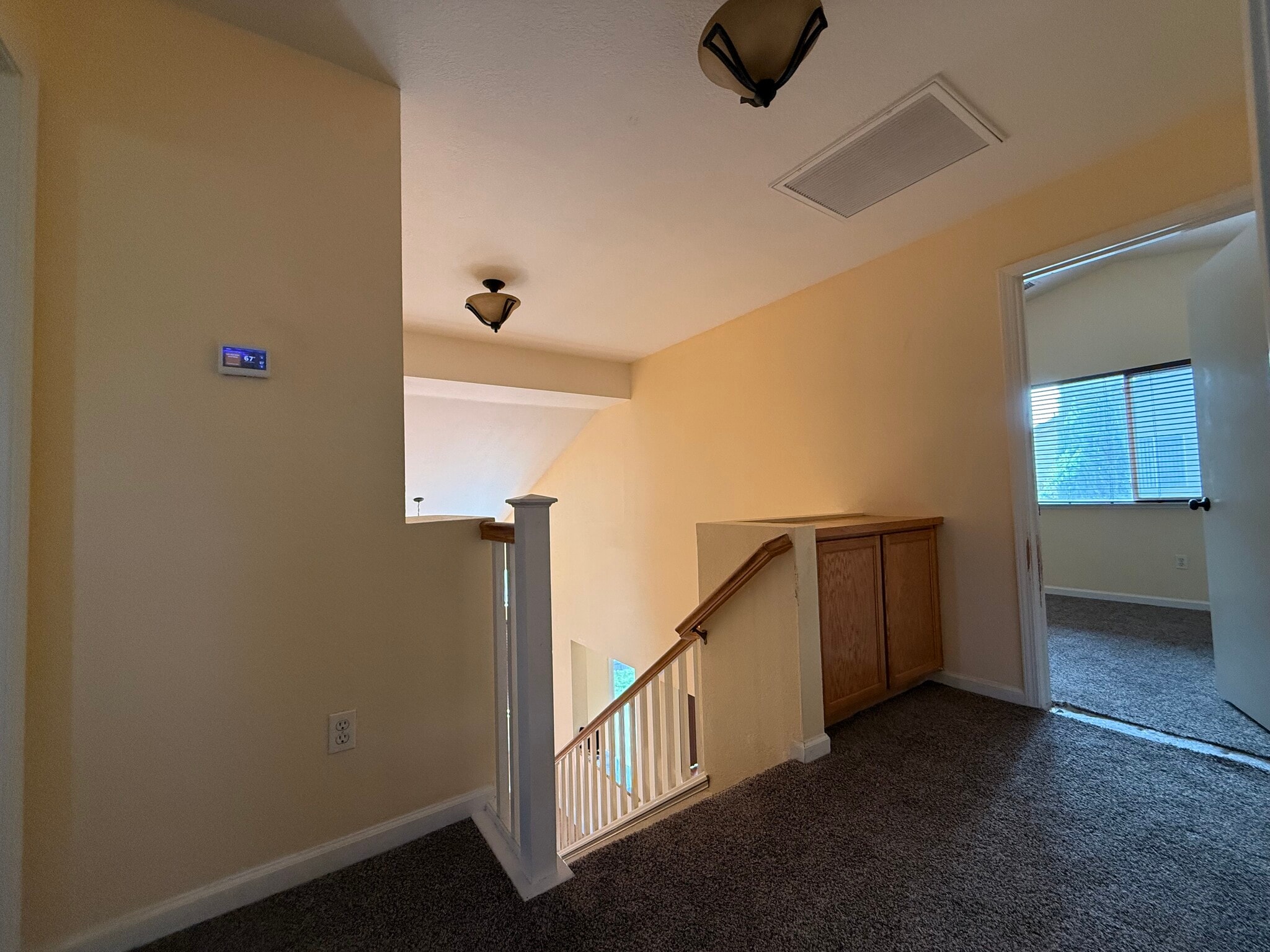 Landing looking toward upstairs spare bedroom from bathroom doorway - 3326 Amberfield Cir