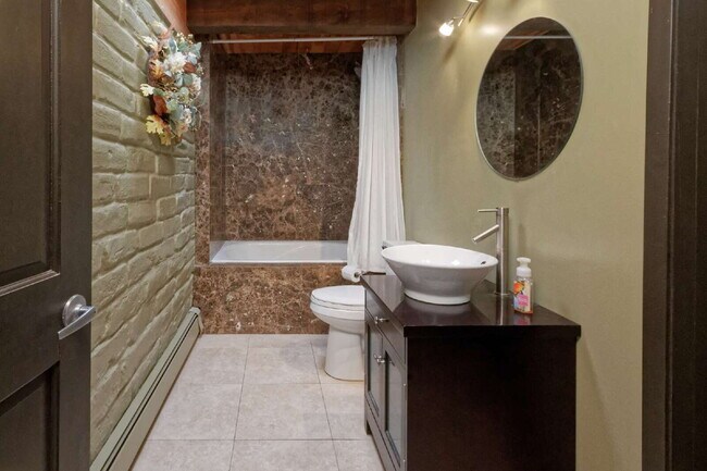 Building Photo - One-of-a-kind adobe brick home backing up ...