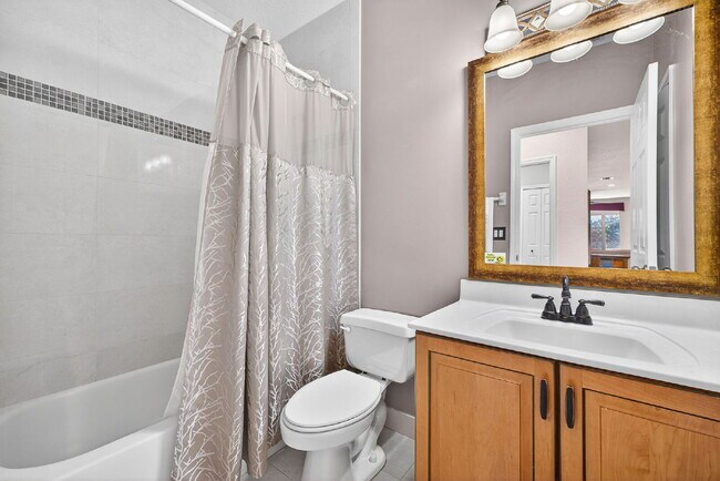 Building Photo - This 2 bedroom plus den, 2 bath condo with a one car garage offers expansive golf course and lake...