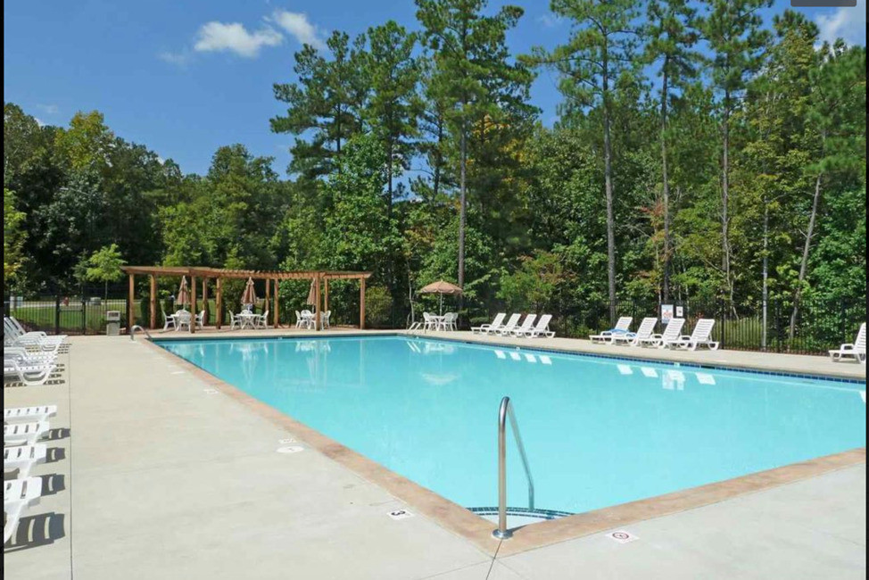 Pool with picnic area and seating - 38 Pocono Dr