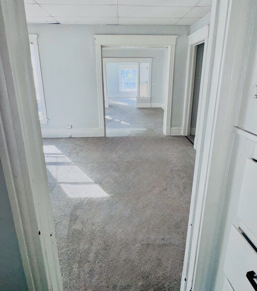 Closet and built-in dresser between the kitchen and office space looking towards apartment front. - 1118 W 8th St