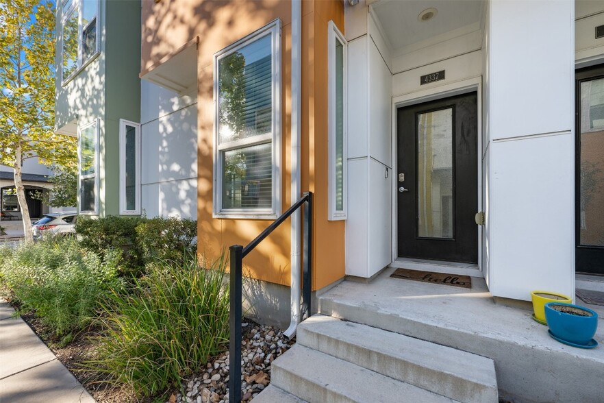 Orange townhouse front door - 4337 Nitschke St