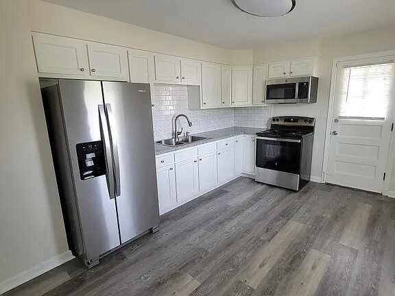 Building Photo - Beautiful Mid-Century home completely updated with two first-floor bedrooms, a spacious second-fl...
