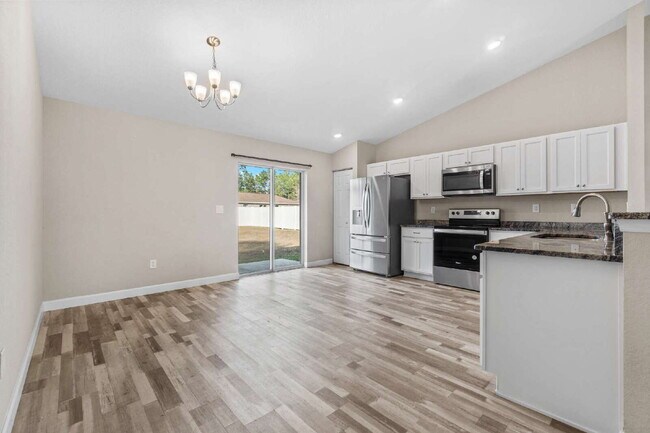 Building Photo - 3BR, 2BA Available Now with Fenced Yard and New Floors, North Marion Oaks