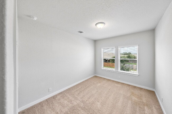 Building Photo - Greenbelt. 3 Car Garage. Built In Dog Room.