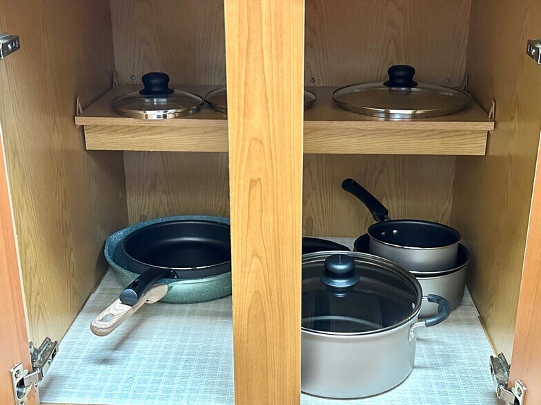 Fully stocked kitchen with pots and pans. - 6464 Starfish Cv