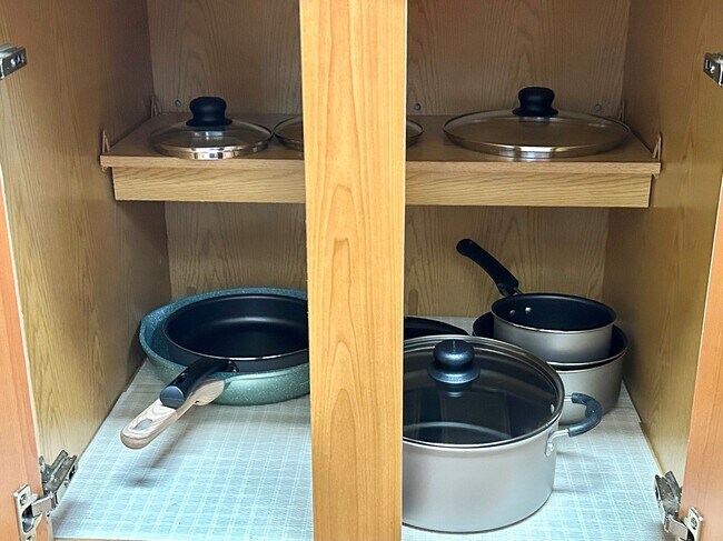 Fully stocked kitchen with pots and pans. - 6464 Starfish Cv