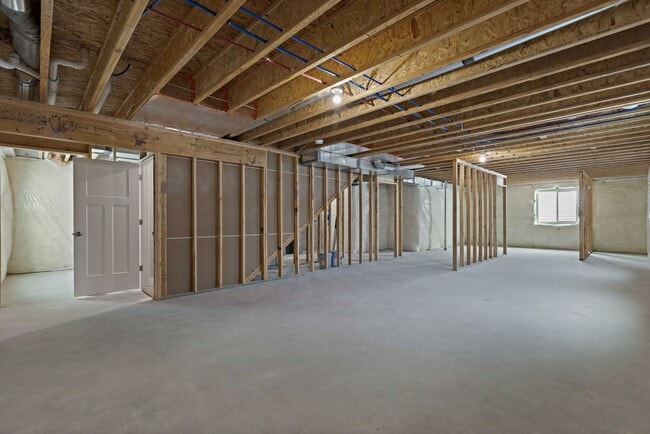 Building Photo - NEW HOME with large garage stalls and unfinished basement for additional storage