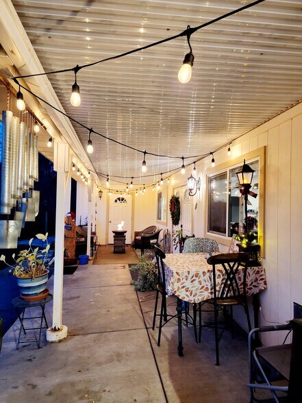 Covered patio aglow at night - perfect for evening dinners alfresco - 10301 Wolf Dr