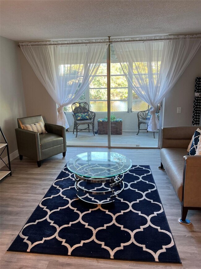 Building Photo - 9070 Lime Bay Blvd