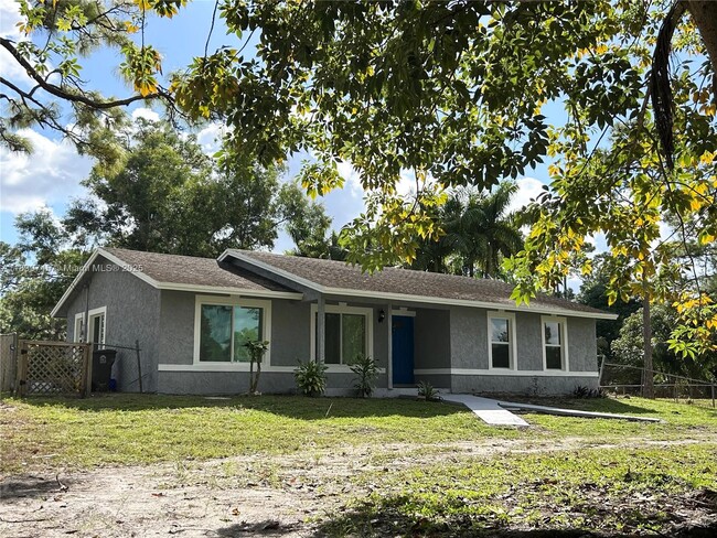 Building Photo - 6452 Royal Palm Beach Blvd