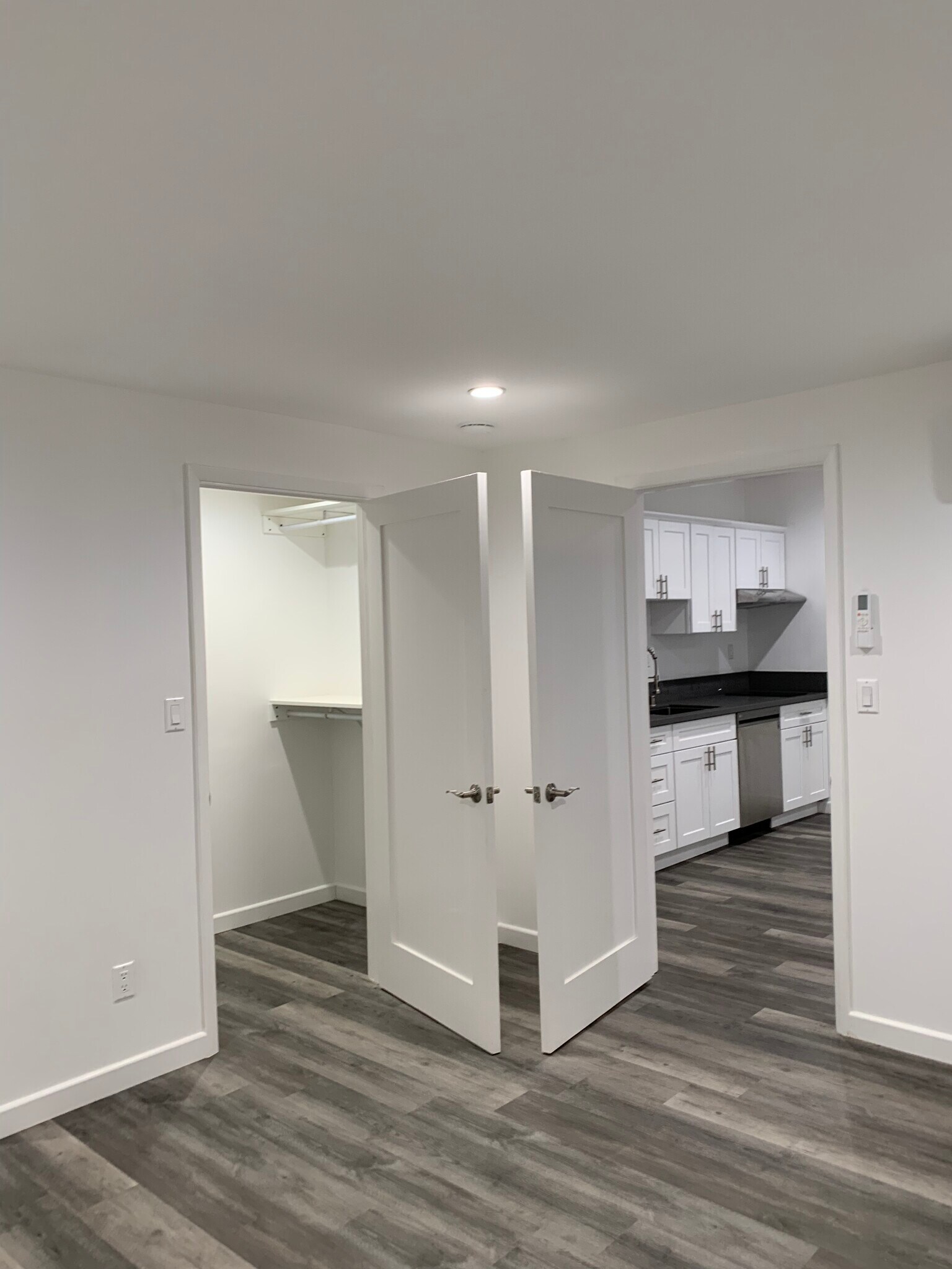 Bedroom, left-walk-in closet, right-living room with open kitchen. - 1102 Centinela Ave