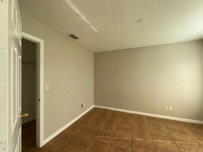 Building Photo - Experience this Cape Coral 3 bedroom 2 bath corner duplex with 1 car garage and screened in lanai.