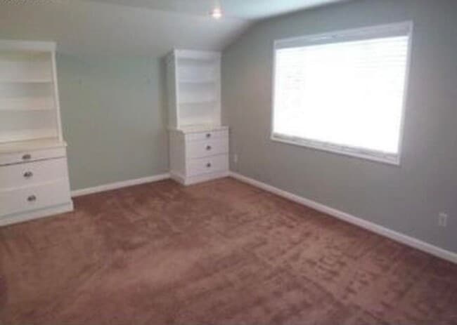 Building Photo - Spacious & light filled home with a garage, backyard, storage & hardwood floors throughout