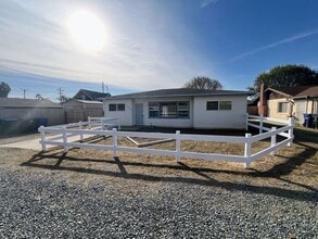 Building Photo - 4 Bedroom Home 2 Car Garage with Fenced Yard and Extra Parking