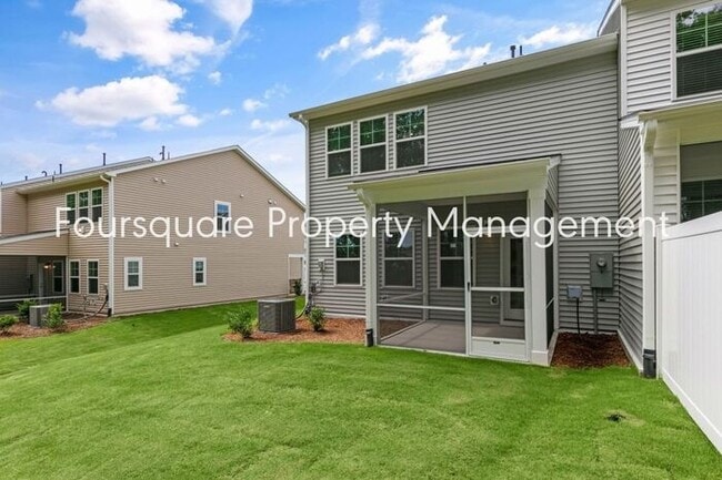 Building Photo - Coming Soon; July 27, 2026 : End unit ToSpacious End-Unit Townhome with 2nd Floor Loft, Screened-...