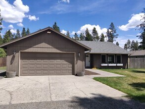 Building Photo - Charming 4-Bedroom Home on 1/2 Acre with a Fenced Backyard, Fully Insulated Double-Car Garage, in...