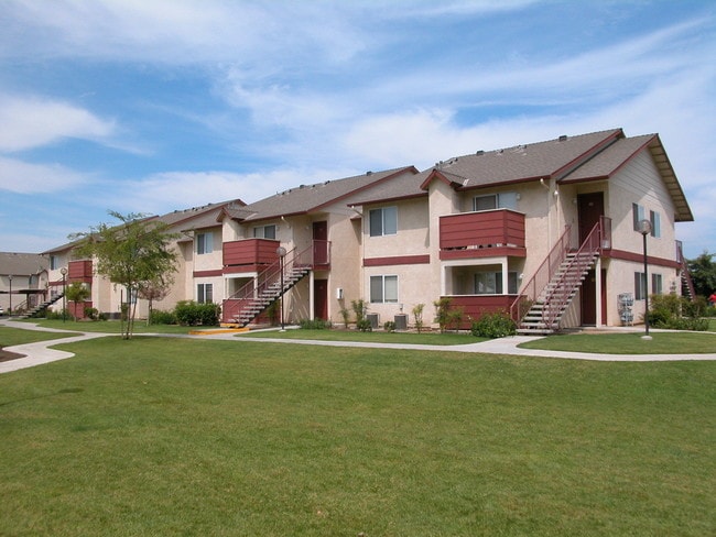 Building Exterior View From Grass Area - Westberry Square Apartments