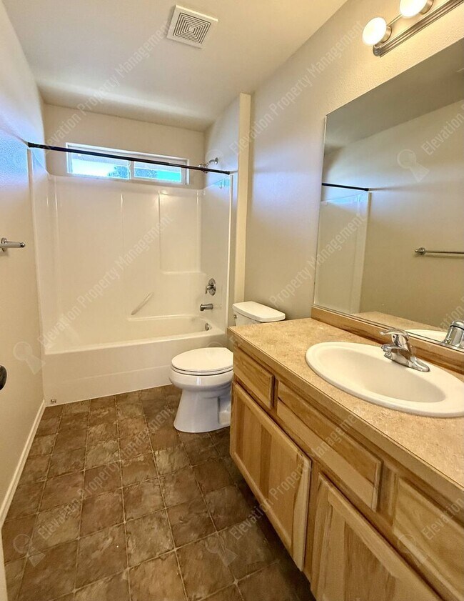 Building Photo - Updated 3 BR/2.5  BA with new flooring and paint!