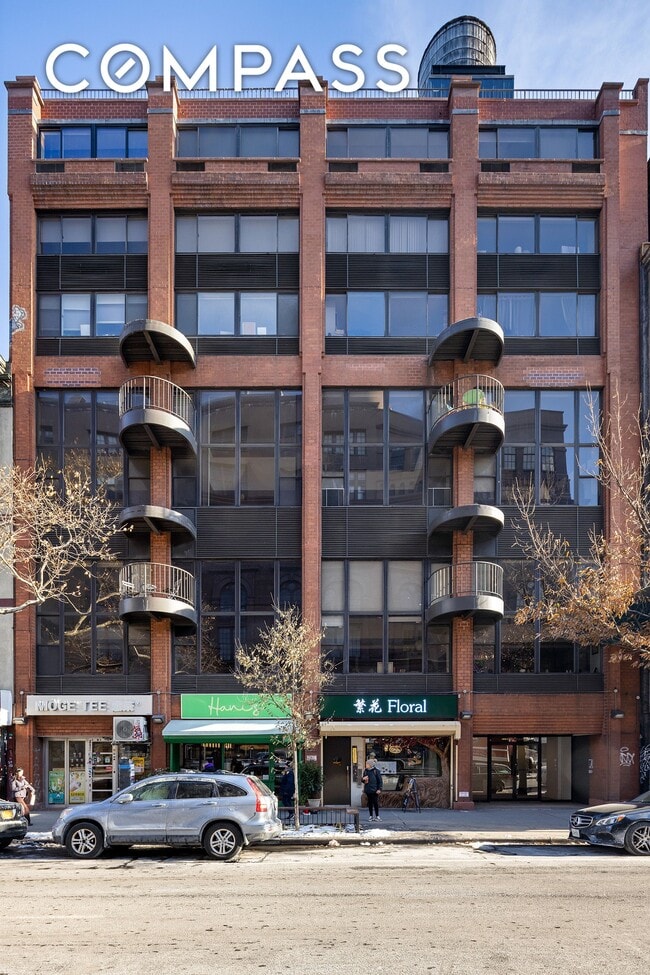 Building Photo - Loft-style one-bedroom with double-height ceilings, oversized windows, and private garden in the ...