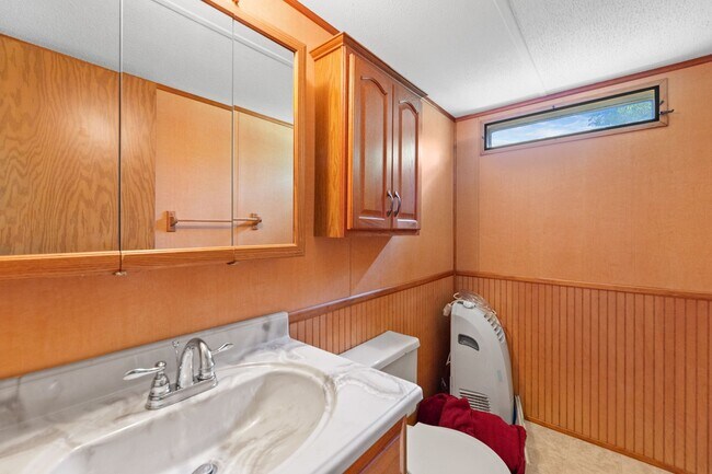 Building Photo - Updated mobile home on acre lot with garag...