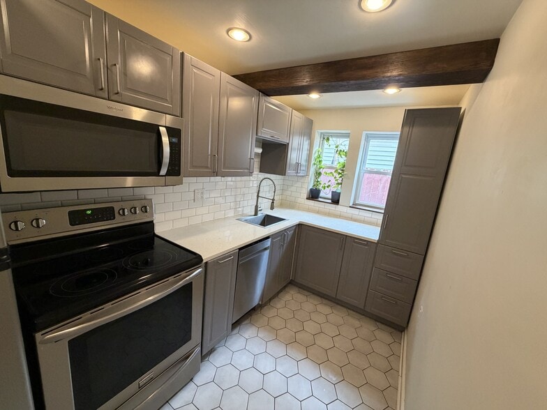 kitchen with microwave, oven, and dishwasher - 2230 Ritter St