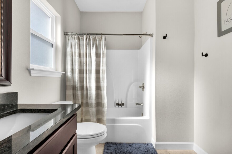 Master bathroom with his & her sinks, fresh towels, hair dryer, soap, shampoo, and conditioner - 28 Snook Rd