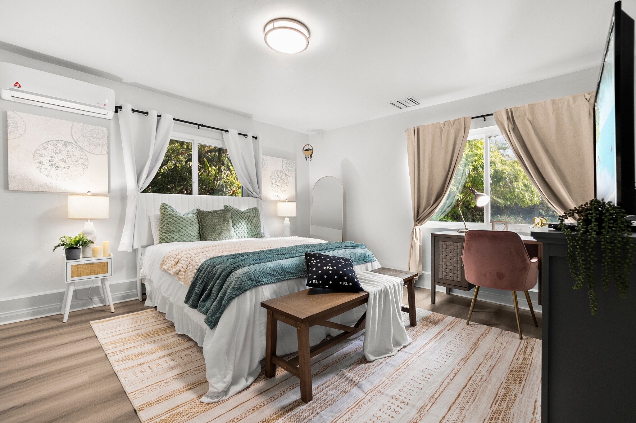 Work and unwind! This bedroom features a cozy workspace for productivity. - 4989 Randlett Dr