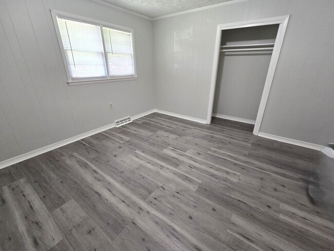 Building Photo - 3/2 with Fenced Yard; In-town and Near an ...