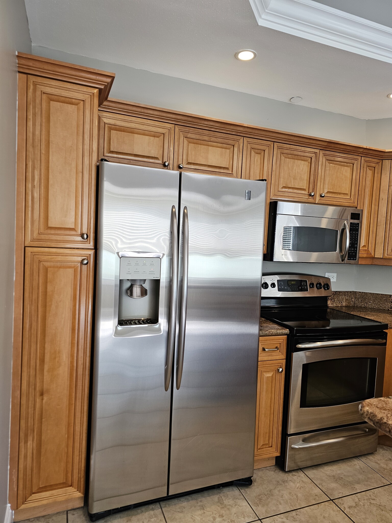 Kitchen with stainless appliances - 8111 Lakewood Main St