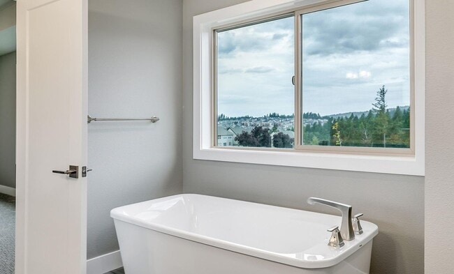 Building Photo - Bethany Stunner - 5 Bedrooms with Main-Level Bed & Bath, Modern Kitchen & Private Fenced Yard