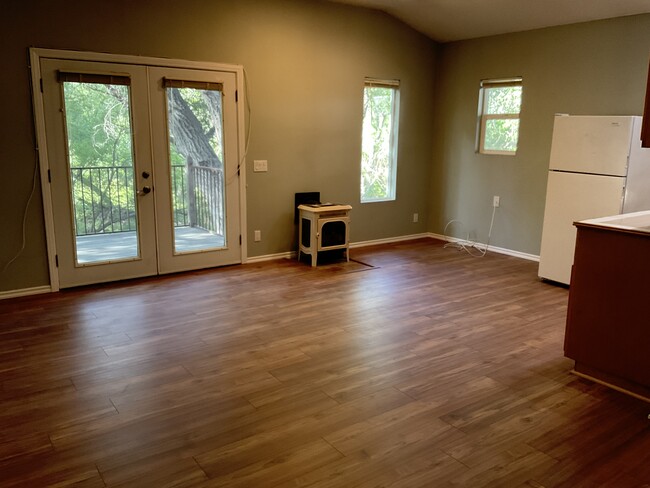 Private entrance, skylight windows, deck overlooks natural creek & oak trees. Park in garage - 85 Sherwood Dr