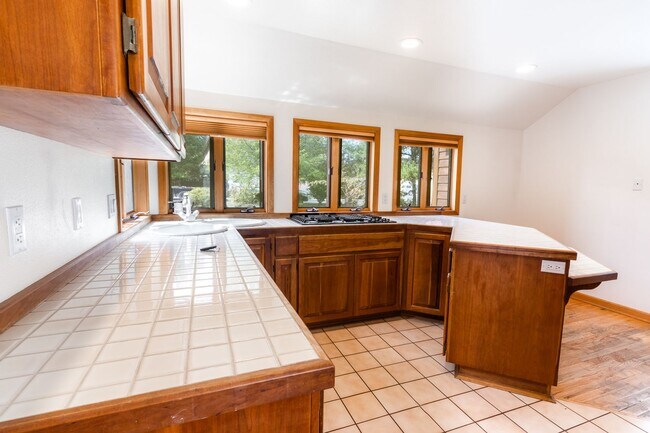 Building Photo - Private river access and stunning views from this home on Harmon Blvd! + Bonus Room