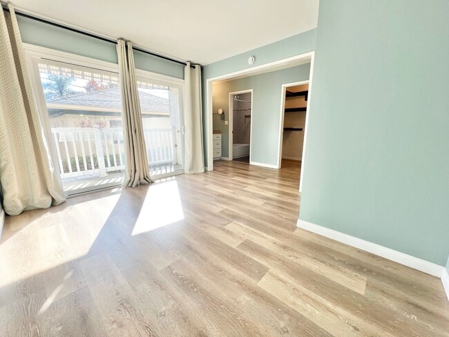 Building Photo - Contemporary 2 Bed Condo with 2 Garage Parking Spaces, Community Pool, and 3 Private Balconies