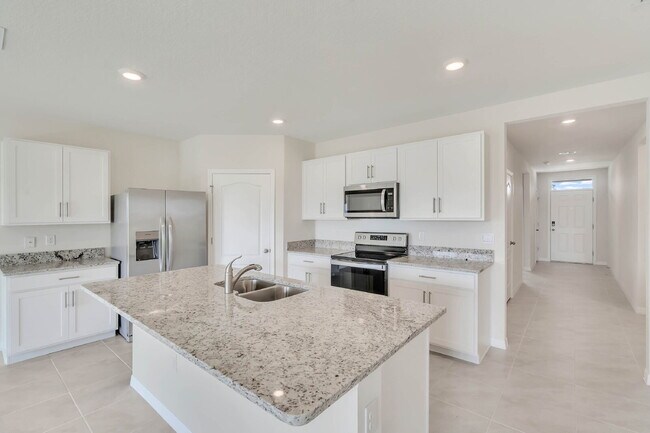 Building Photo - 4 bedrooms and 2 bathrooms, the spacious 1,828 sq ft home features an open concept with a 2 car g...