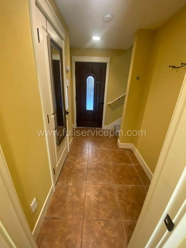 Building Photo - Spacious townhome with private backyard, garage parking, multiple decks, and a dedicated home off...