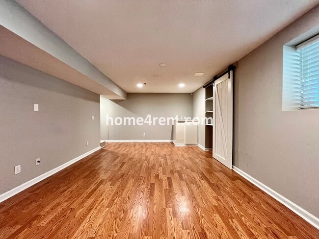 Building Photo - Updated Kitchen, Large Two Tiered Deck, Finished Basement in Blue Valley Schools!