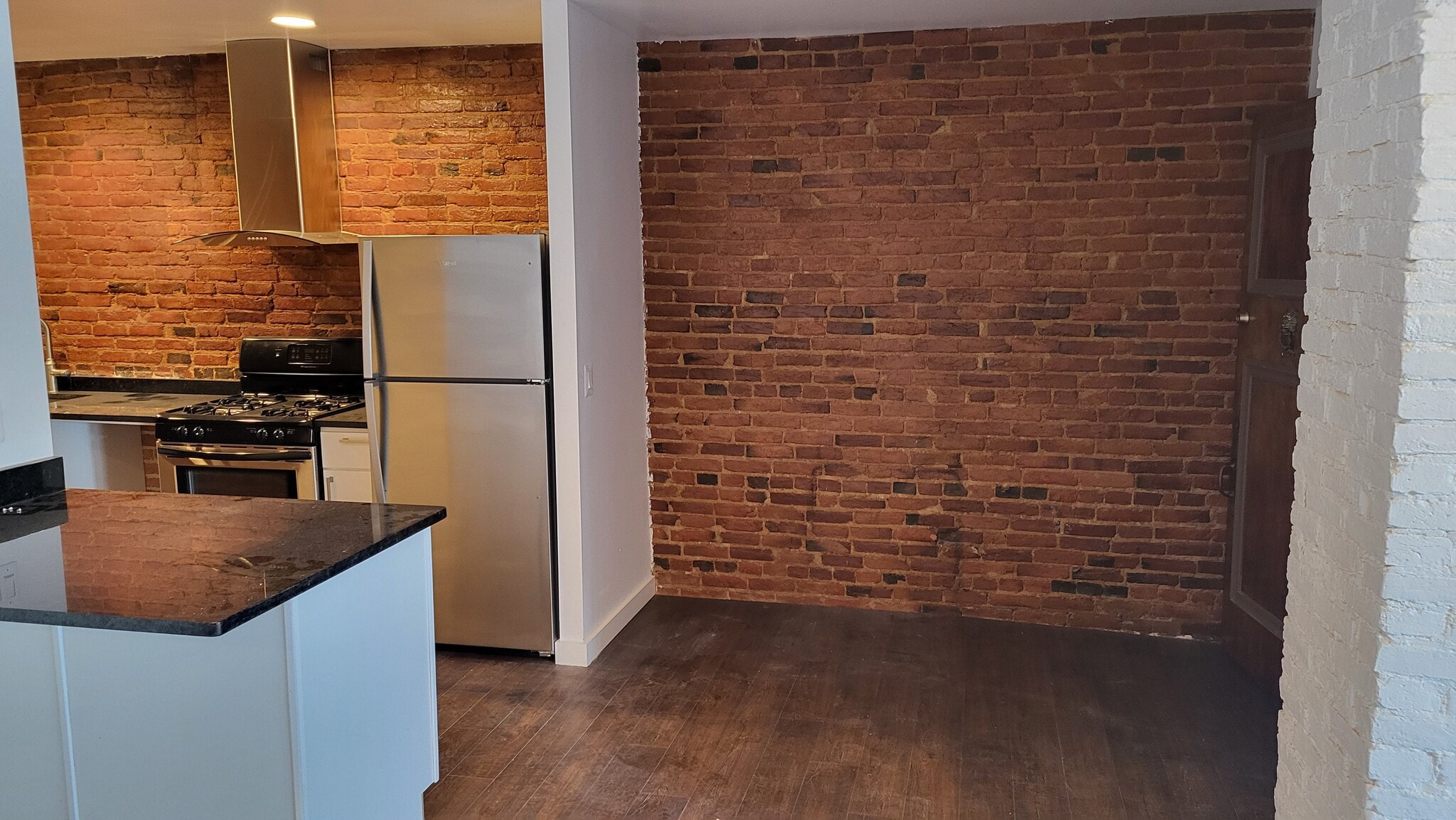 Great exposed brick throughout with enough room for a mudroom - 403 N Charles St