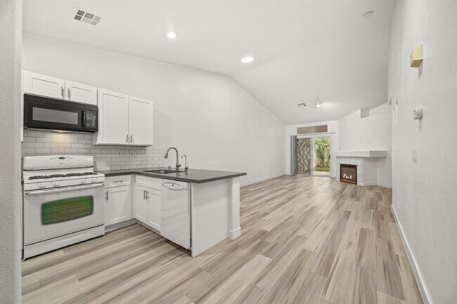 Building Photo - Charming and spacious single-story townhome nestled within a gated community in the desirable Nor...