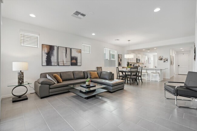 Spacious living room with modern furniture througout - 9014 W Oregon Ave
