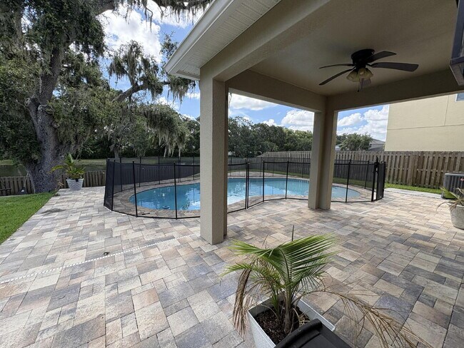 Building Photo - Spacious 5-Bedroom Pool Home with Putting ...