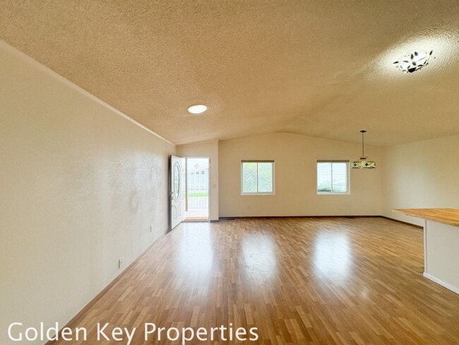 Building Photo - Welcome to the spacious single-level manuf...