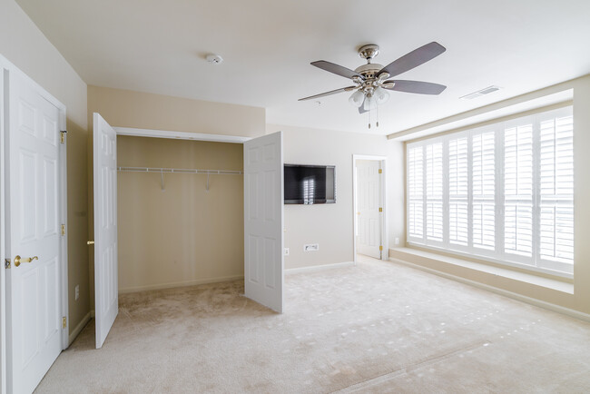 Spacious master bedroom with two large closets (one walk in closet) ceiling fan with remote, large windows with plantation shutters and flat screen HD TV included with rental. - 22785 Settlers Trail Terrace