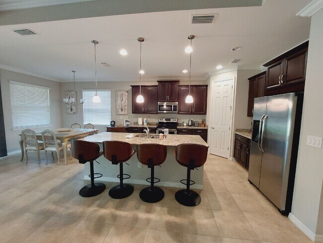 Building Photo - Luxurious Home in Toscana Isles Gated Community