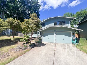 Building Photo - Spacious Poulsbo Home with Large Basement, Fenced Yard & Garden Space