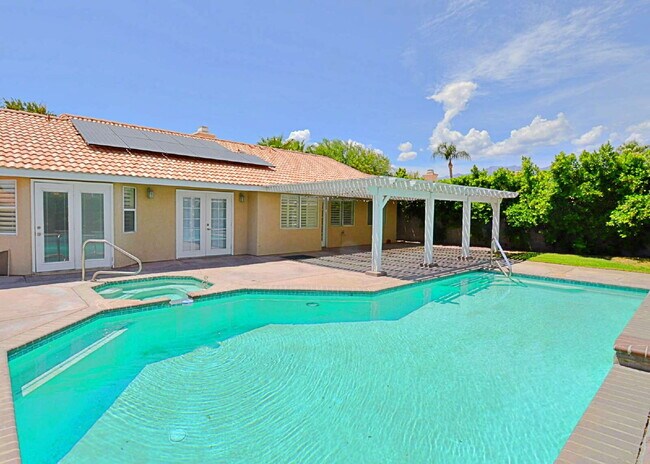Building Photo - "Charming Oasis: 3-Bedroom Cathedral City Retreat with Pool, Fireplace, and Granite Kitchen!"