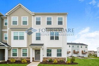Building Photo - Three Story Town Home | Entry Level Bedroo...