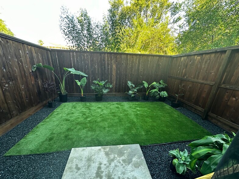 Back area with newly luxury installed turf - 8705 Bryam