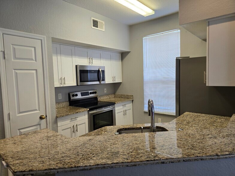 Building Photo - 9058 Lake Chase Island Way