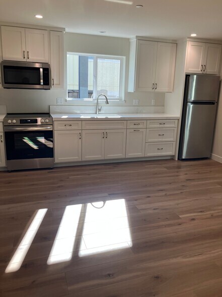 The kitchen/living/dining room are all open allowing for flexible arrangement of furniture. - 548 Blanca St